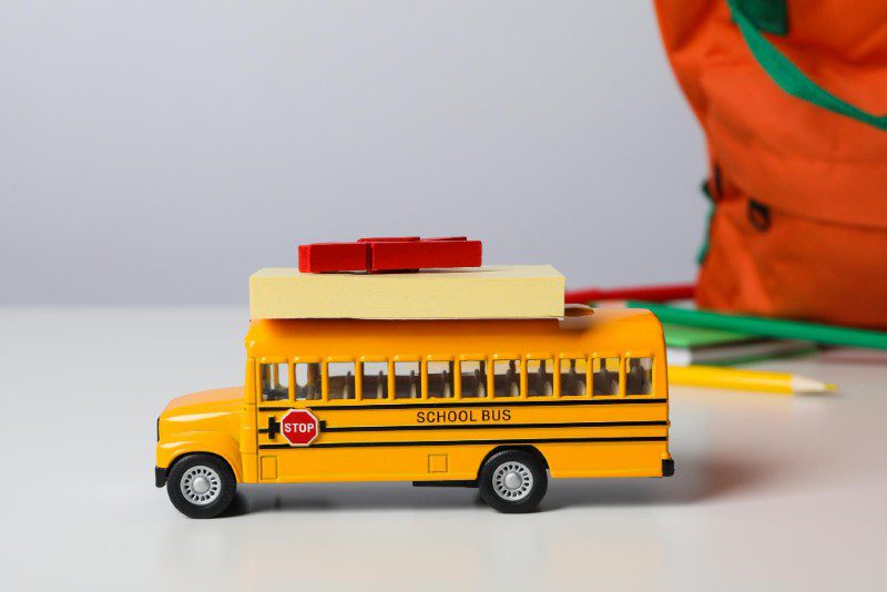 Toy yellow school bus on a table