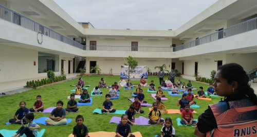 Copy of Group yoga session on the school campus.