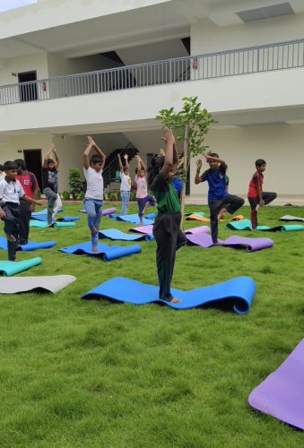 Copy of Students performing yoga asanas during the session.