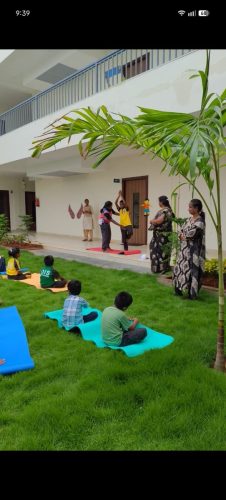 Copy of Teachers guiding students in different yoga postures.